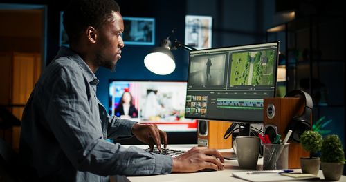 Rear view of man working at office