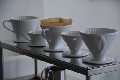 Different types of cups arranged in row