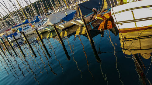 Tilt shot of boats moored at harbor