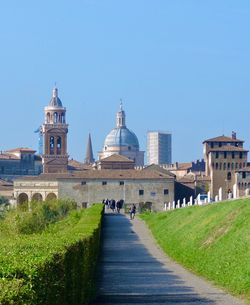 View of historic buildings against blue sky in mantova