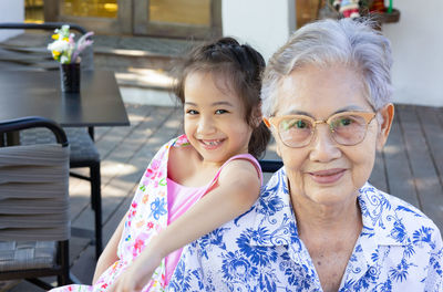 Portrait of smiling friends at home