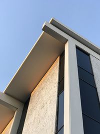 Low angle view of building against clear blue sky