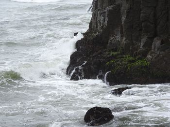 Waves splashing on rocks