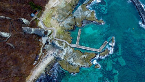 High angle view of sea seen through airplane