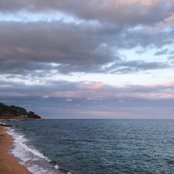 Scenic view of sea against cloudy sky