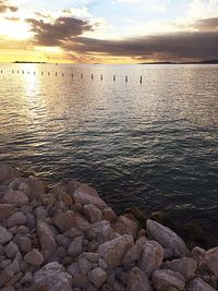 Scenic view of sea against cloudy sky