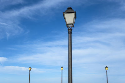 Low angle view of street light against sky