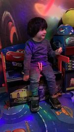 Boy playing with toy toys