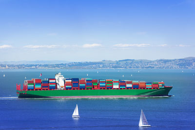 Nautical vessel on sea against blue sky