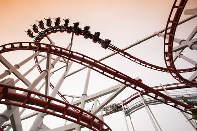 Low angle view of ferris wheel against sky