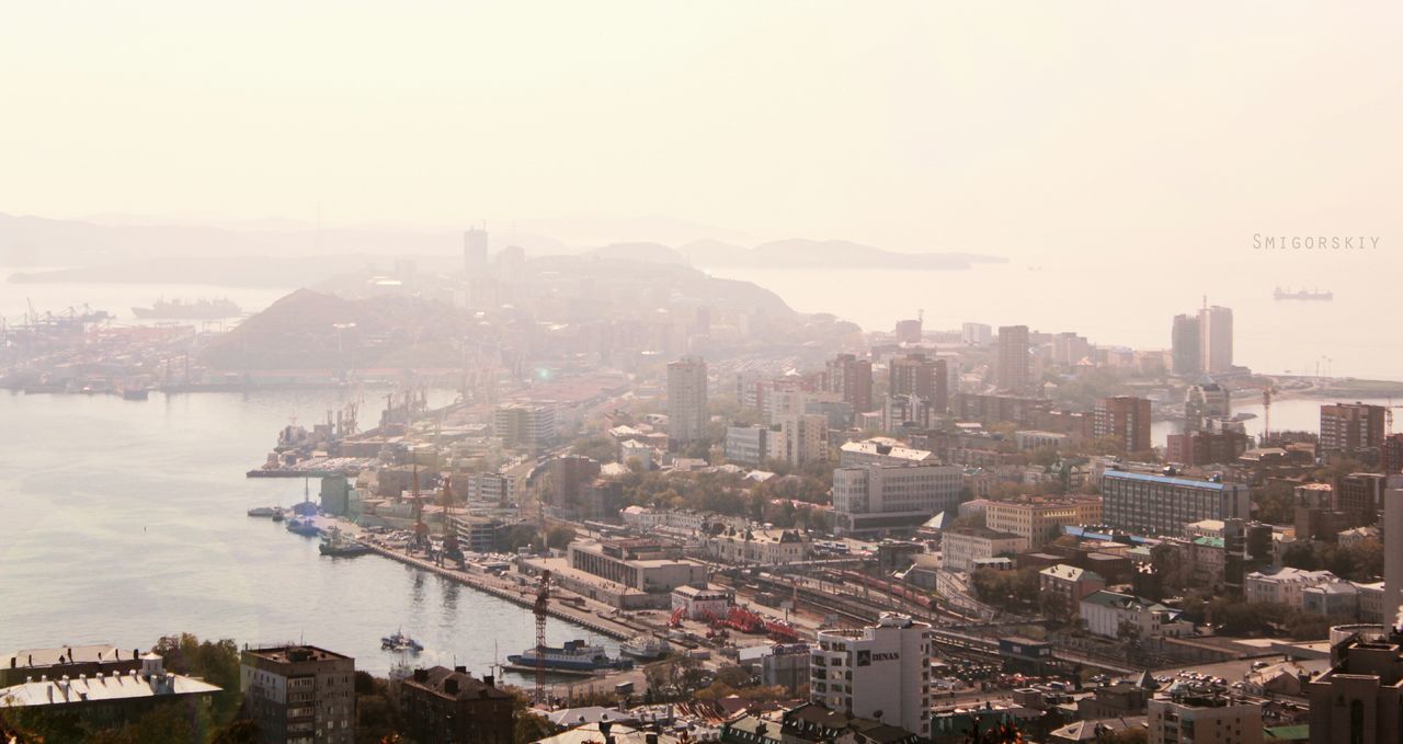 building exterior, architecture, built structure, city, cityscape, high angle view, copy space, water, crowded, residential district, clear sky, river, residential building, residential structure, sea, sky, city life, outdoors, day, no people