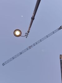 Low angle view of street light against clear sky