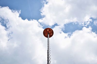 Low angle view of communications tower against sky