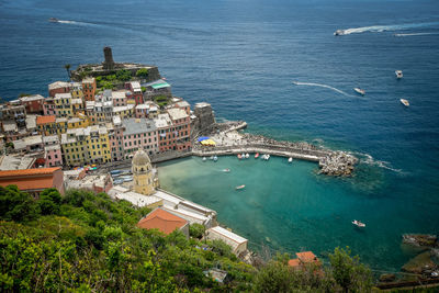 High angle view of buildings by sea