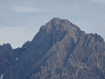 Low angle view of rock formations against sky