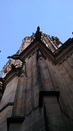 Low angle view of building against clear blue sky