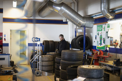 Car mechanic in garage