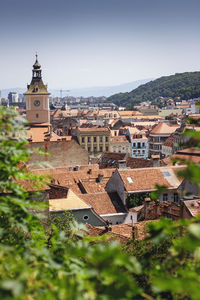 Buildings in town against clear sky