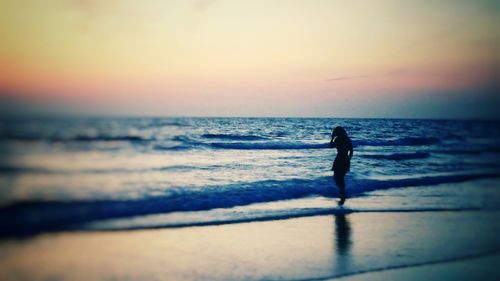 Silhouette of people on beach