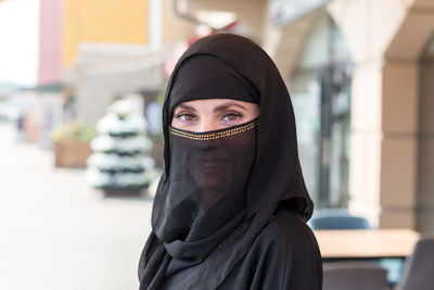 Close-up of woman wearing hat