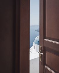 Close-up of sea against sky seen through window