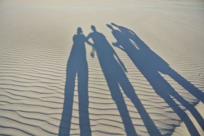 Shadow of people on sand