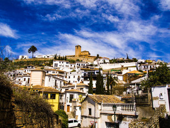 Town against cloudy sky