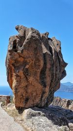 Low angle view of sculpture on rock