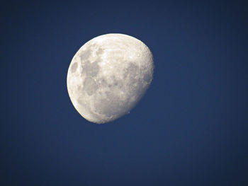 Low angle view of moon against clear sky at night