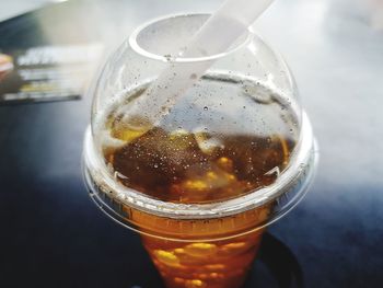 Close-up of beer glass on table