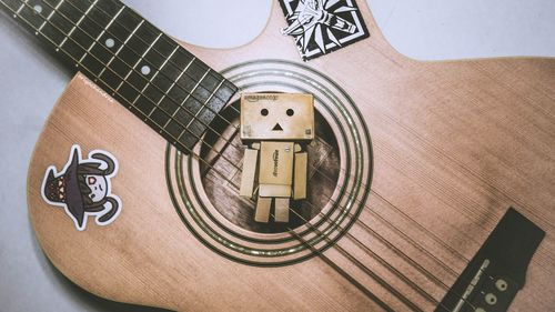 High angle view of guitar on table