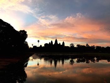 Scenic view of lake at sunset