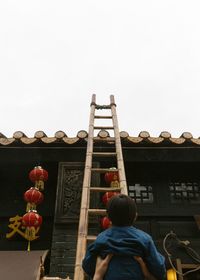 Woman standing against clear sky