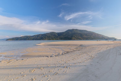 Scenic view of beach against sky