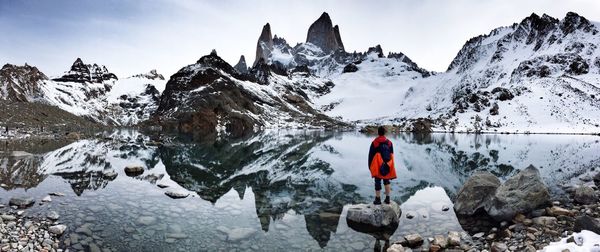 Scenic reflection of snowed mountains in calm lake