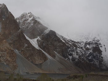 Aerial view of snowcapped mountains against sky