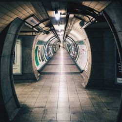 Empty illuminated subway tunnel