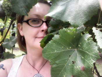 Portrait of young woman with leaves