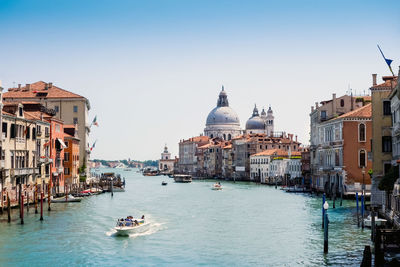 Grand canal and santa maria della salute against sky in city