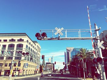 Low angle view of buildings against clear blue sky