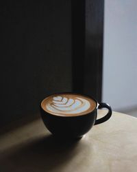 Close-up of coffee cup on table