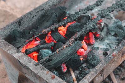 High angle view of fire on wood