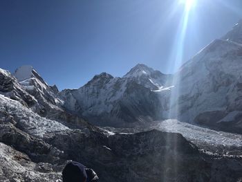 Scenic view of snowcapped mountains against clear sky