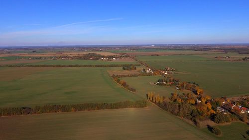 Scenic view of agricultural landscape against sky