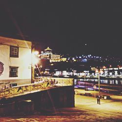 Illuminated buildings in city at night