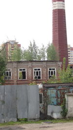 Low angle view of abandoned building against sky