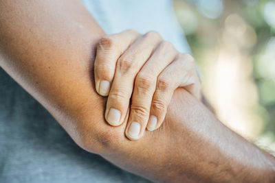 Close-up of woman hand on finger