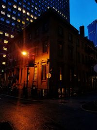 View of illuminated street at dusk