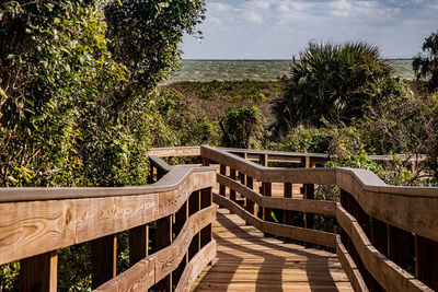 Built structure by trees against sky