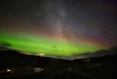 Scenic view of mountains against sky at night